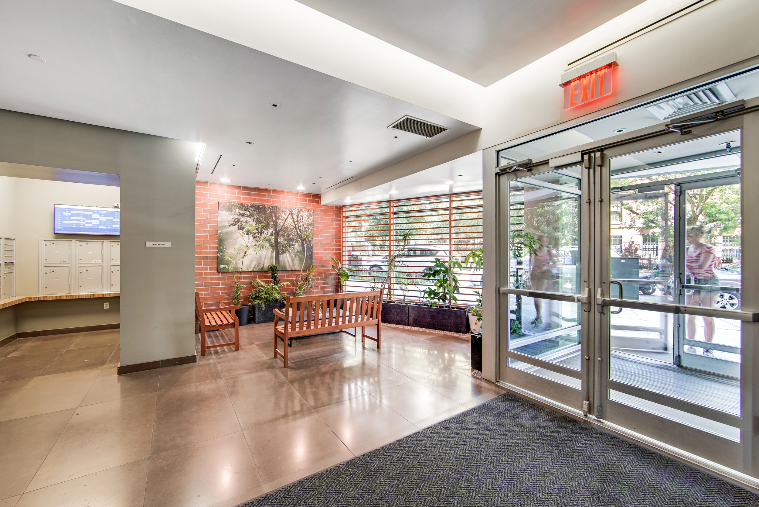212 South Oxford Street, Unit 7K Brooklyn, NY 11217 - Photo 15 of 16 a lobby with furniture and floor to ceiling window