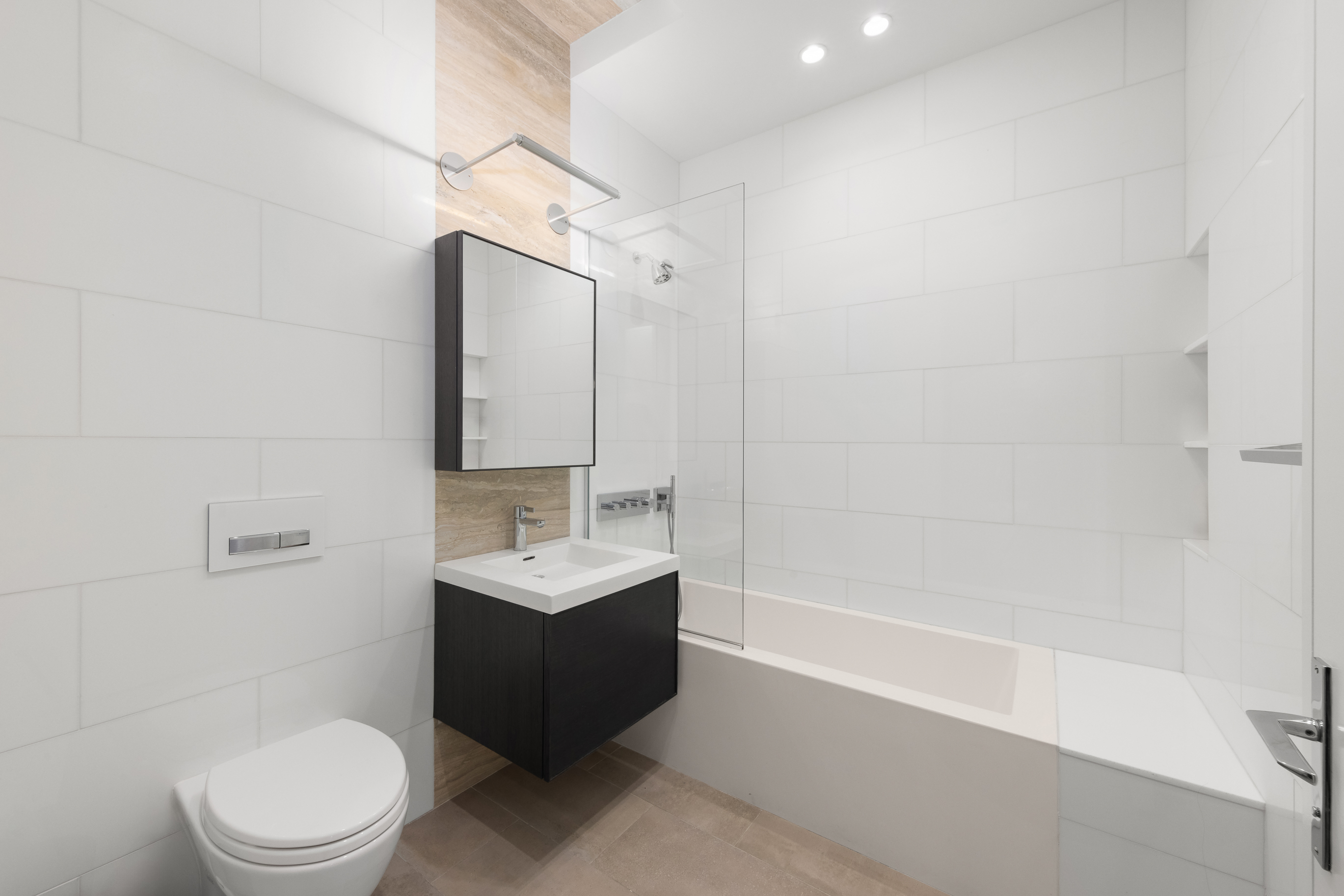 88 Lexington Avenue, Unit 1606 Manhattan, NY 10010 - Photo 16 of 20 a bathroom with a sink a toilet and shower