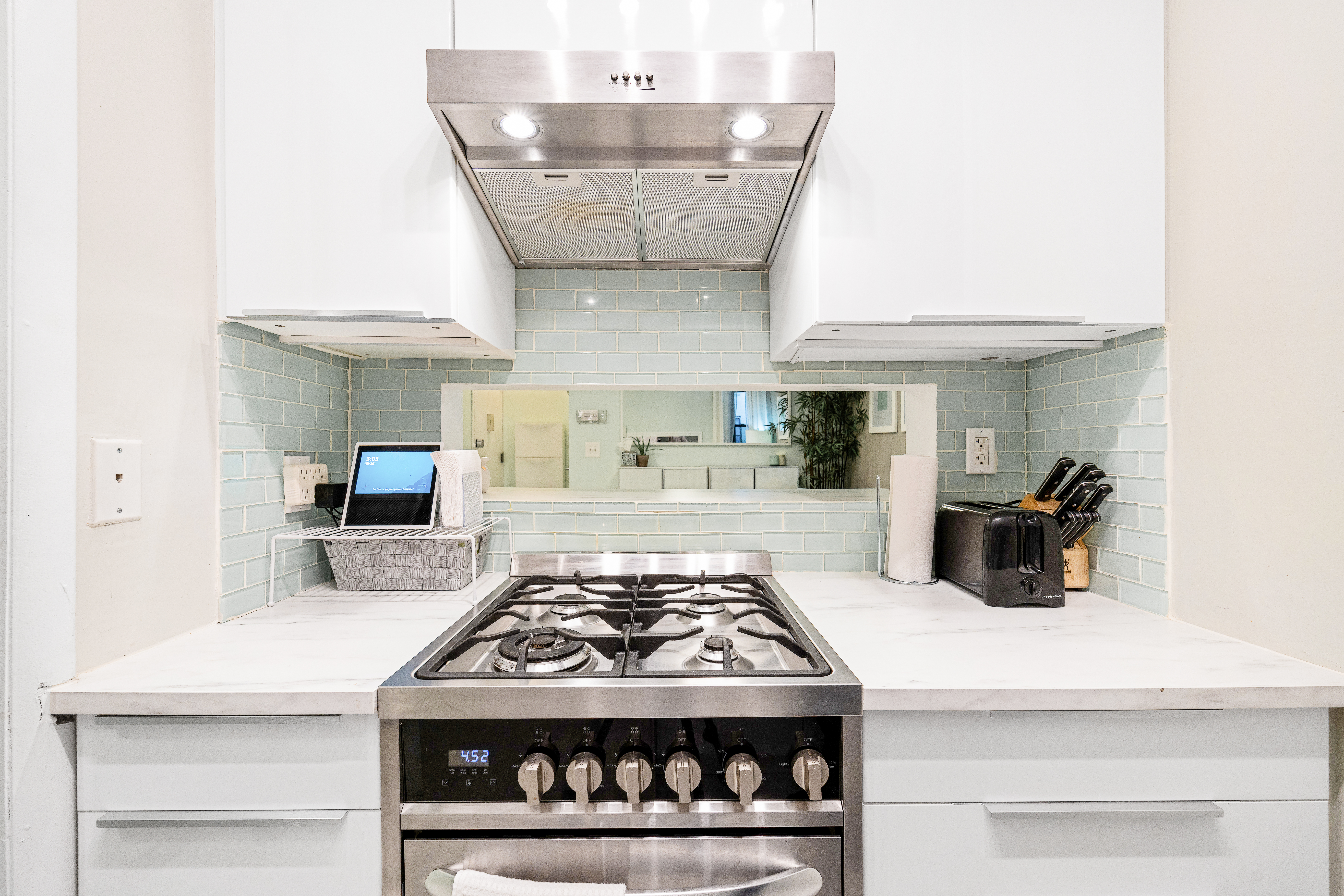 108 West 114th Street, Unit 4B Manhattan, NY 10026 - Photo 5 of 9 a kitchen with a stove and cabinets