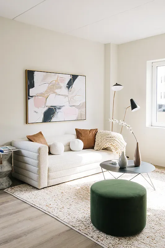 a bedroom with a bed and a couch