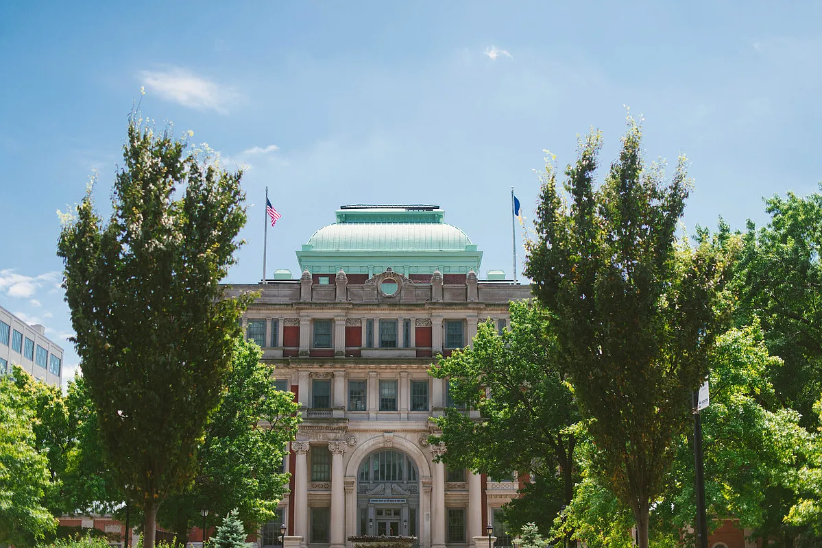26-14 Jackson Avenue, Unit PHD Queens, NY 11101 - Photo 8 of 11 a view of a building with trees in front of it