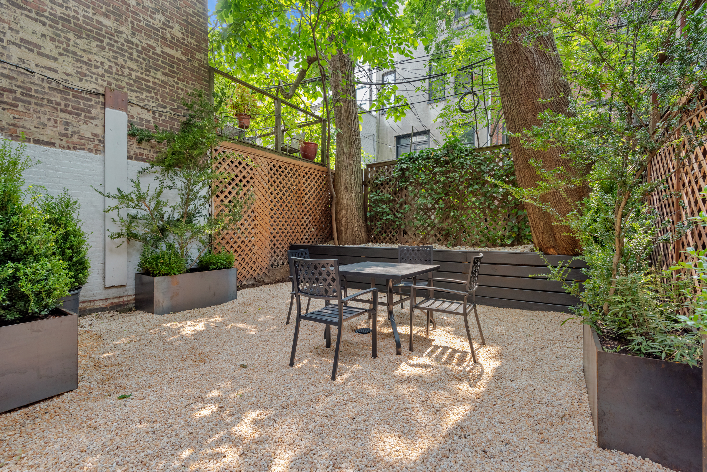 616 2nd Street Brooklyn, NY 11215 - Photo 6 of 19 a patio with table and chairs and potted plants