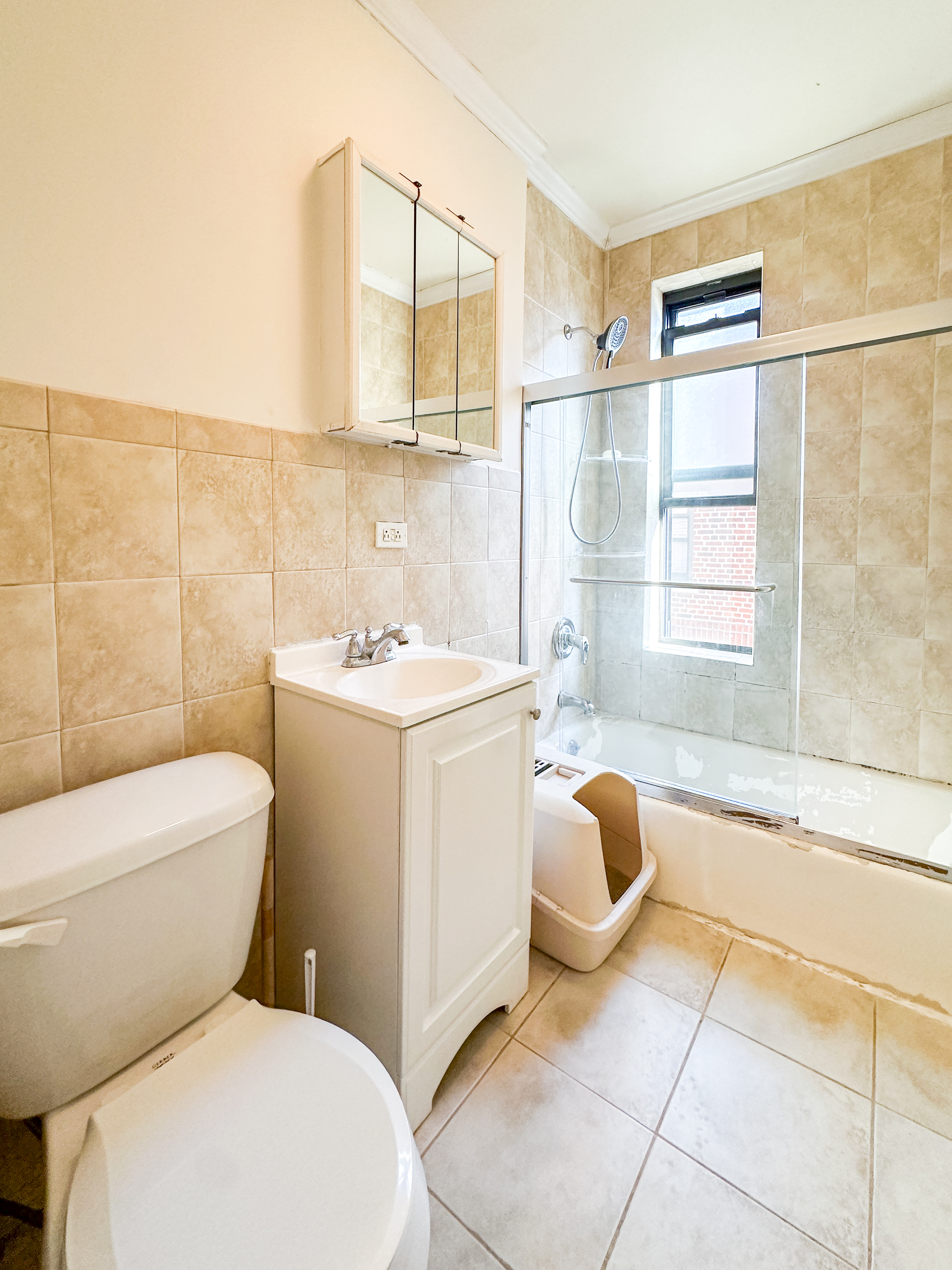 1506 Overing Street, Unit 1D Bronx, NY 10461 - Photo 10 of 10 a bathroom with a sink toilet and shower