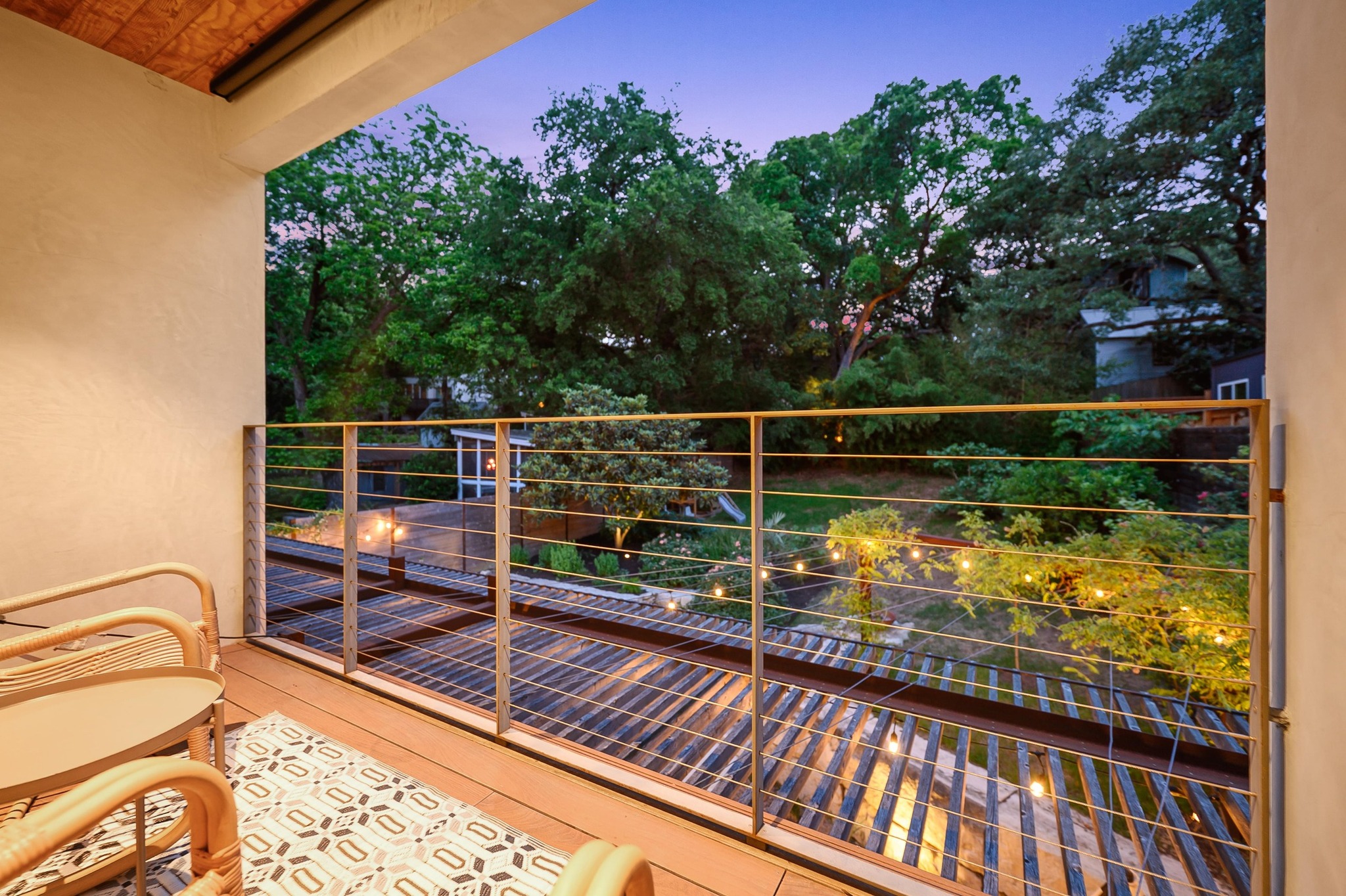 1206 Bickler Road Austin, TX 78704 - Photo 65 of 65 a view of a balcony with two chairs and a table