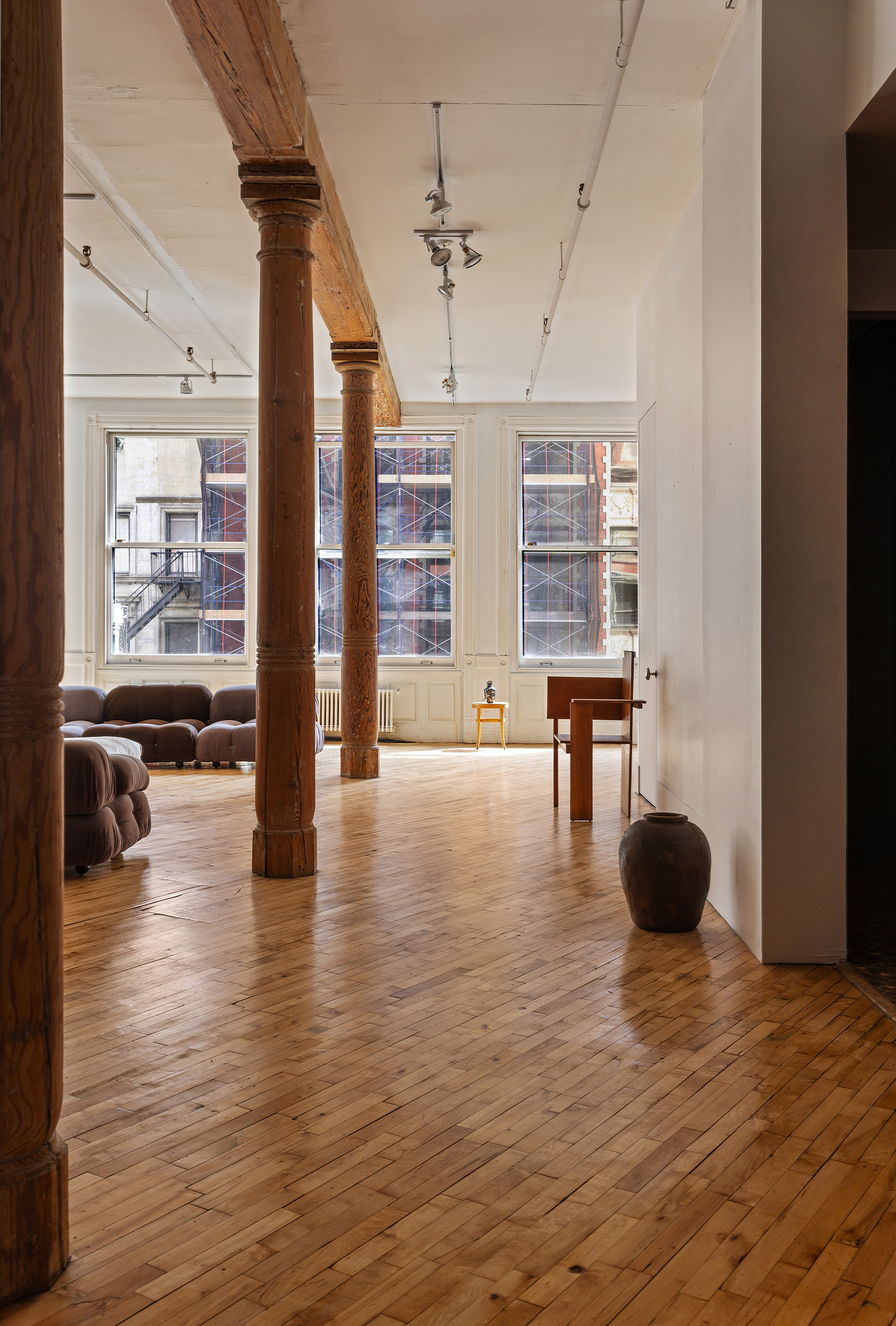 515 Broadway, Unit 4B Manhattan, NY 10012 - Photo 4 of 13 a living room with furniture and a large window
