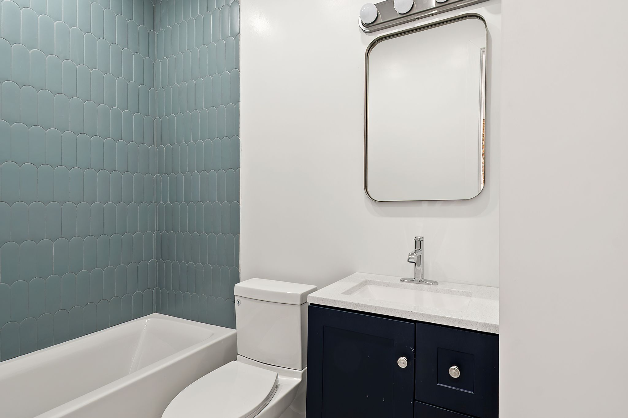 181 Kosciuszko Street Brooklyn, NY 11216 - Photo 13 of 20 a bathroom with a toilet sink and mirror