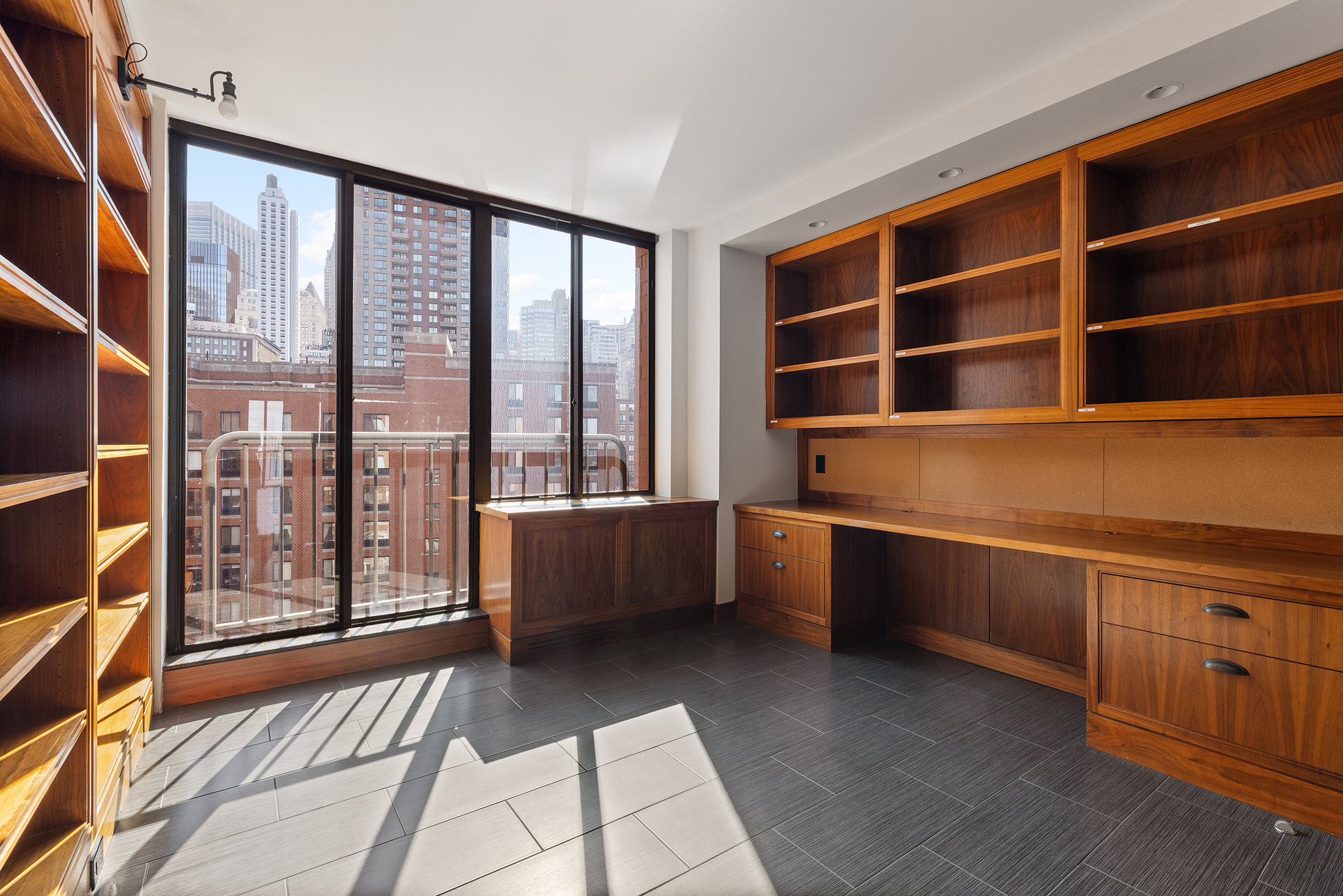 380 Rector Place, Unit 7LMN Manhattan, NY 10280 - Photo 5 of 14 a room with furniture and window