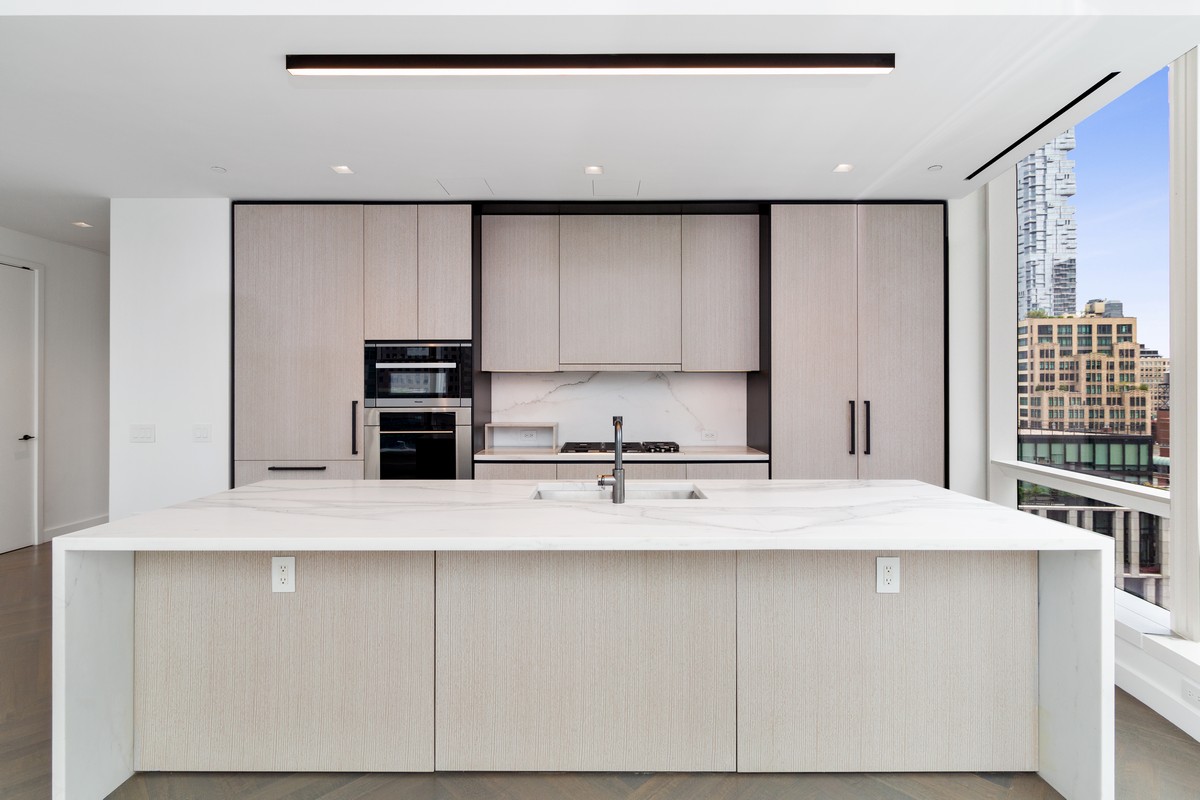 111 Murray Street, Unit 16B Manhattan, NY 10007 - Photo 3 of 22 a view of kitchen with stainless steel appliances cabinets
