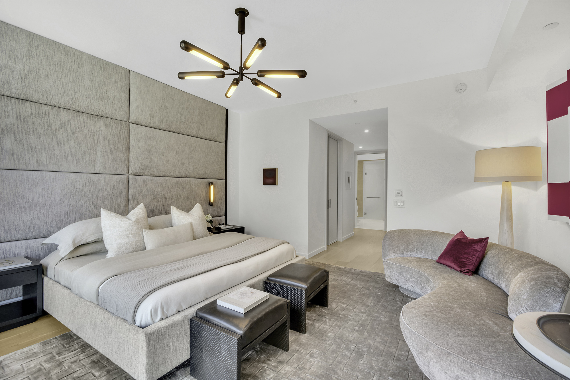 1 West End Avenue, Unit 10A Manhattan, NY 10023 - Photo 11 of 38 a bedroom with a bed and a chandelier