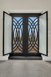a view of two windows with a door