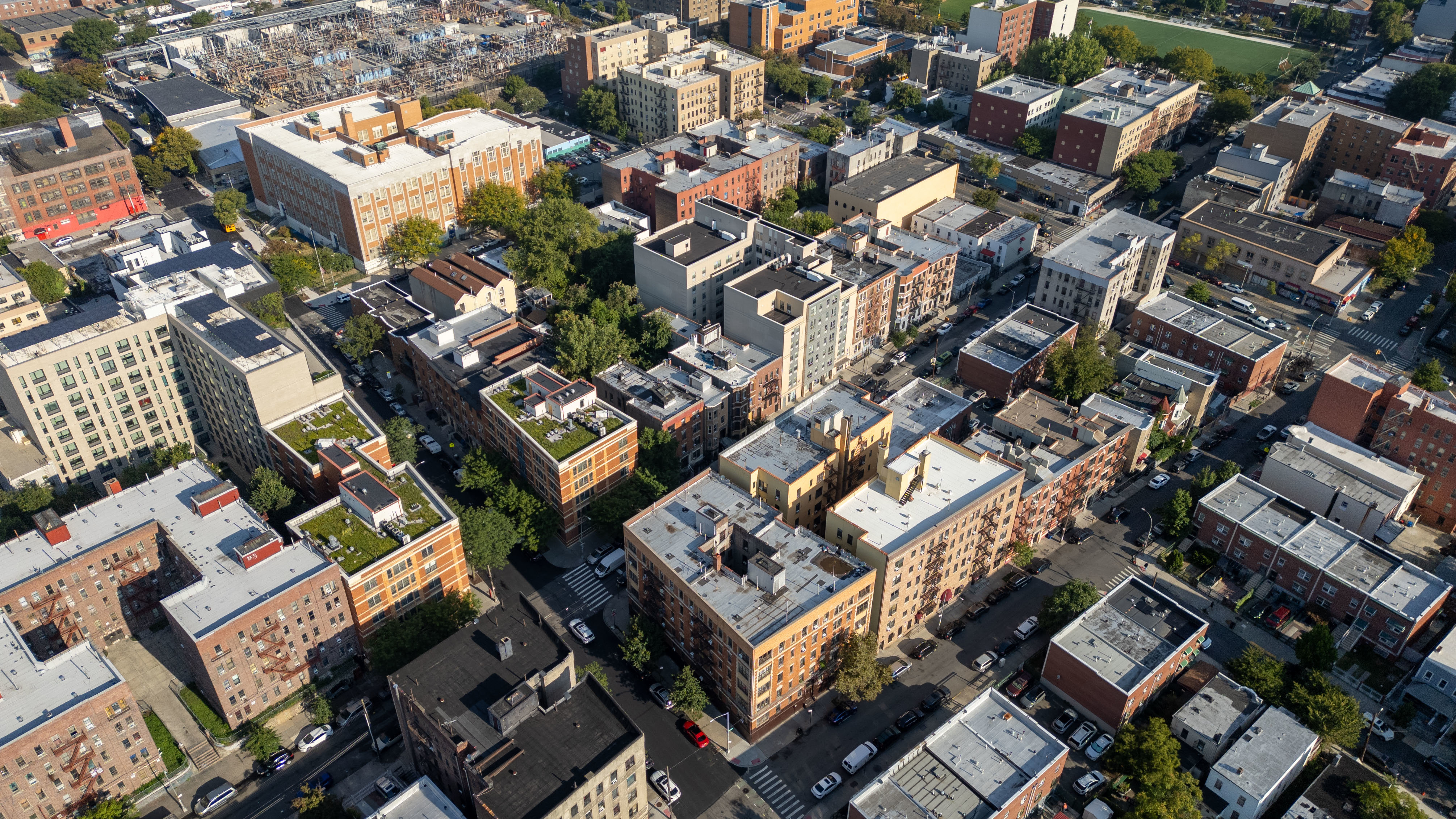 2023 Hughes Avenue Bronx, NY 10457 - Photo 56 of 63 an aerial view of a residential apartment building with parking