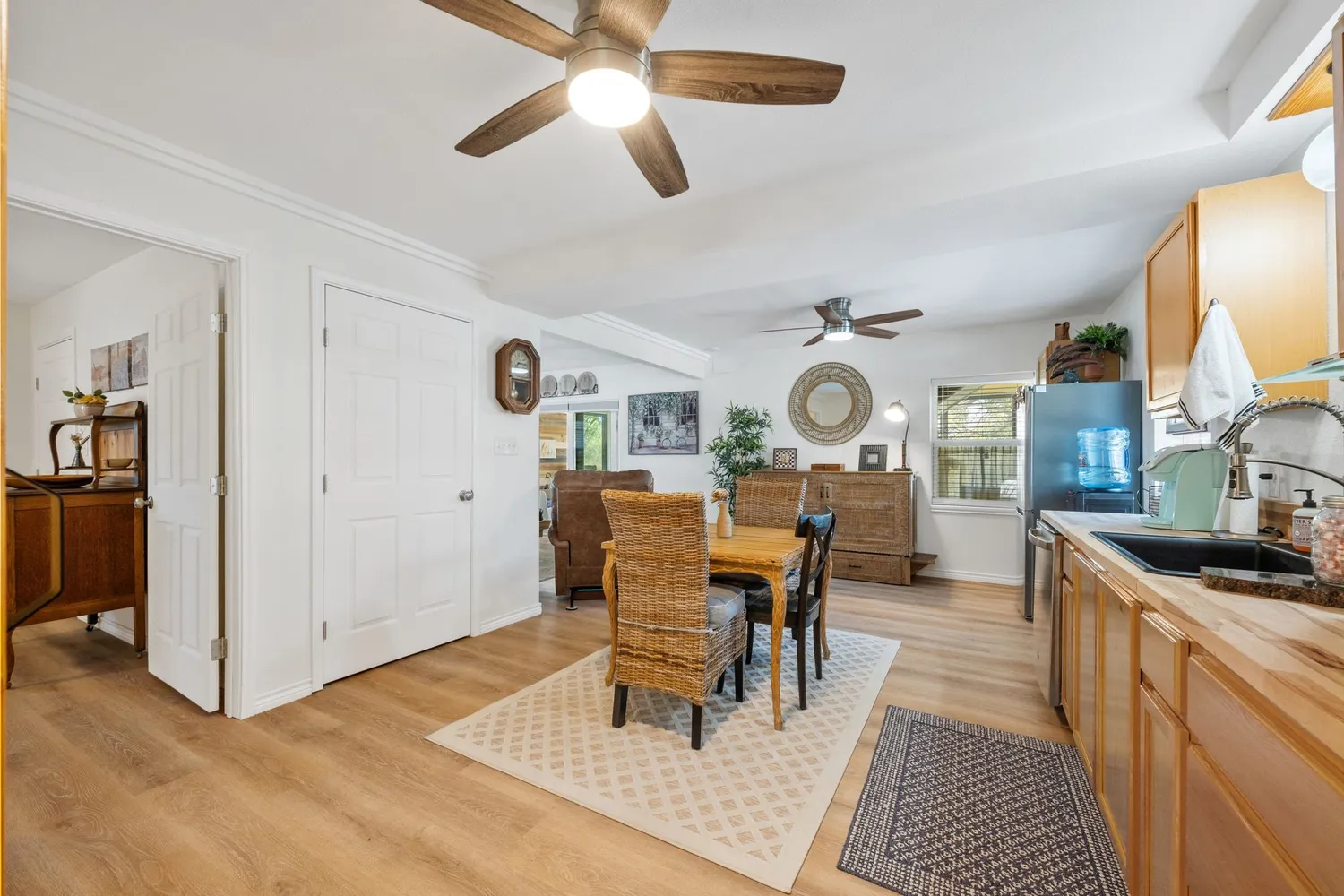 a view of a bathroom with a sink and mirror with toilet