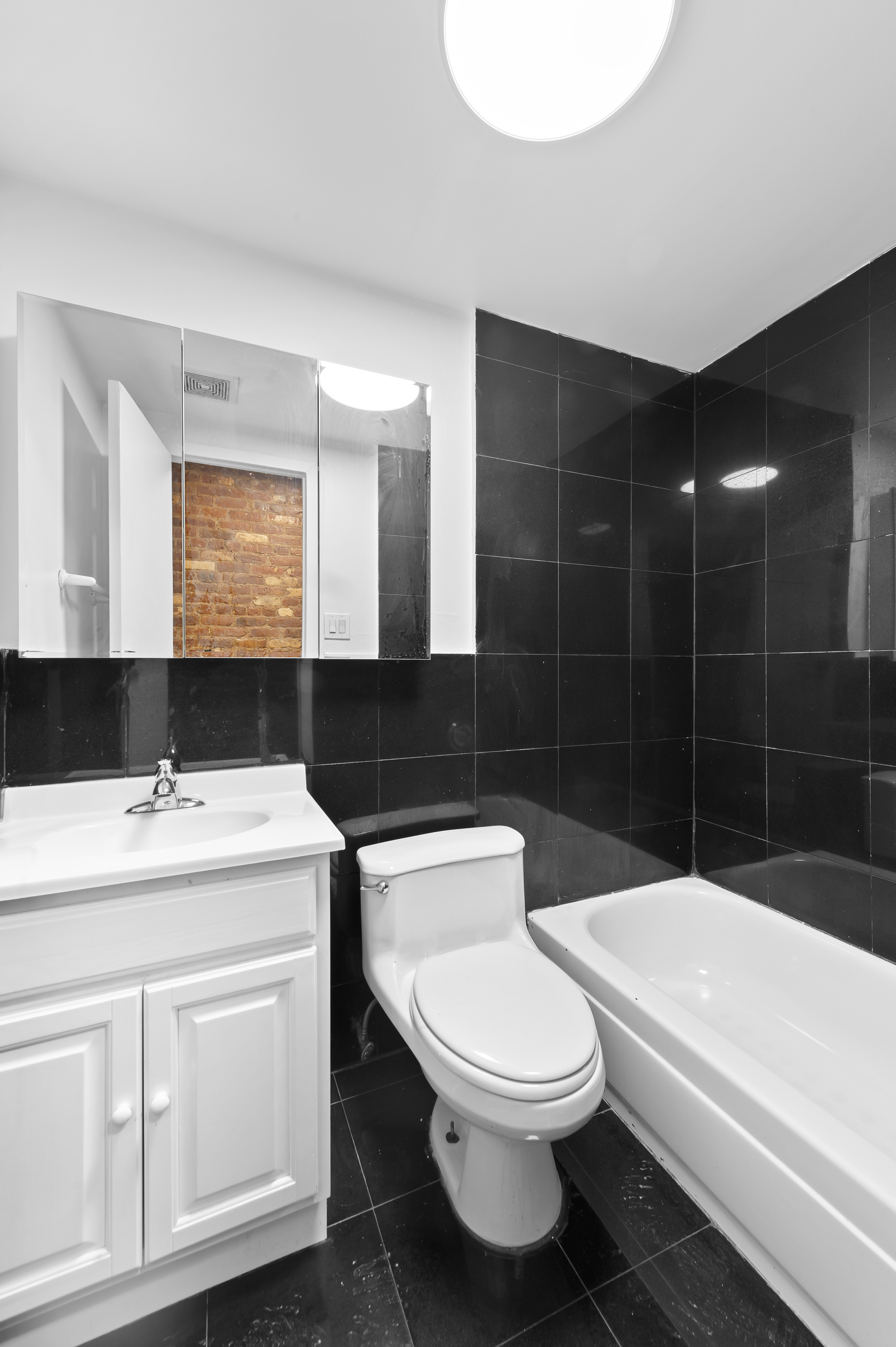 112 East 4th Street, Unit 6 Manhattan, NY 10003 - Photo 5 of 5 a bathroom with a toilet a sink and bathtub