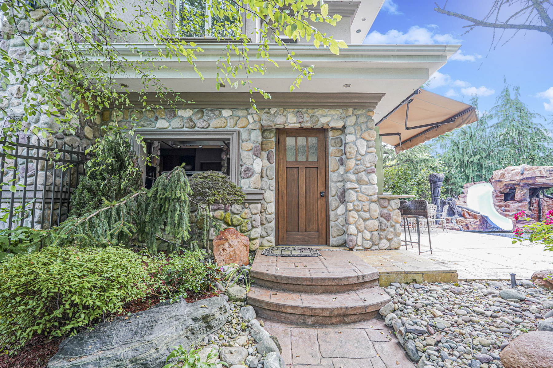165 Swaim Avenue Staten Island, NY 10312 - Photo 29 of 45 a front view of a house with fountain