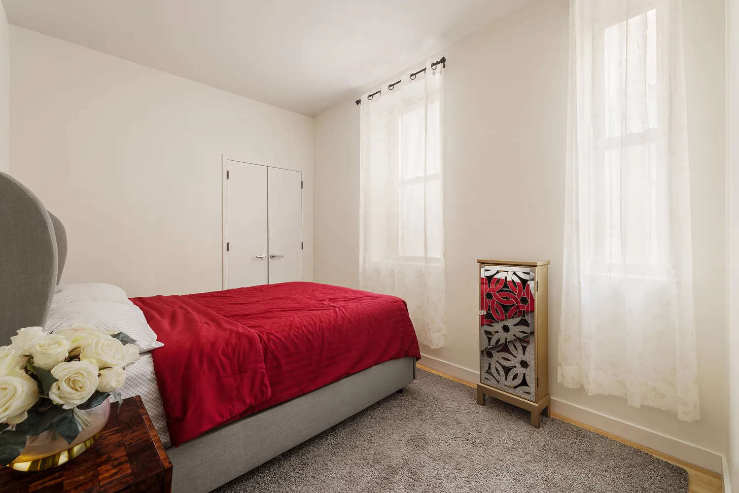 a bed room with a bed and a window