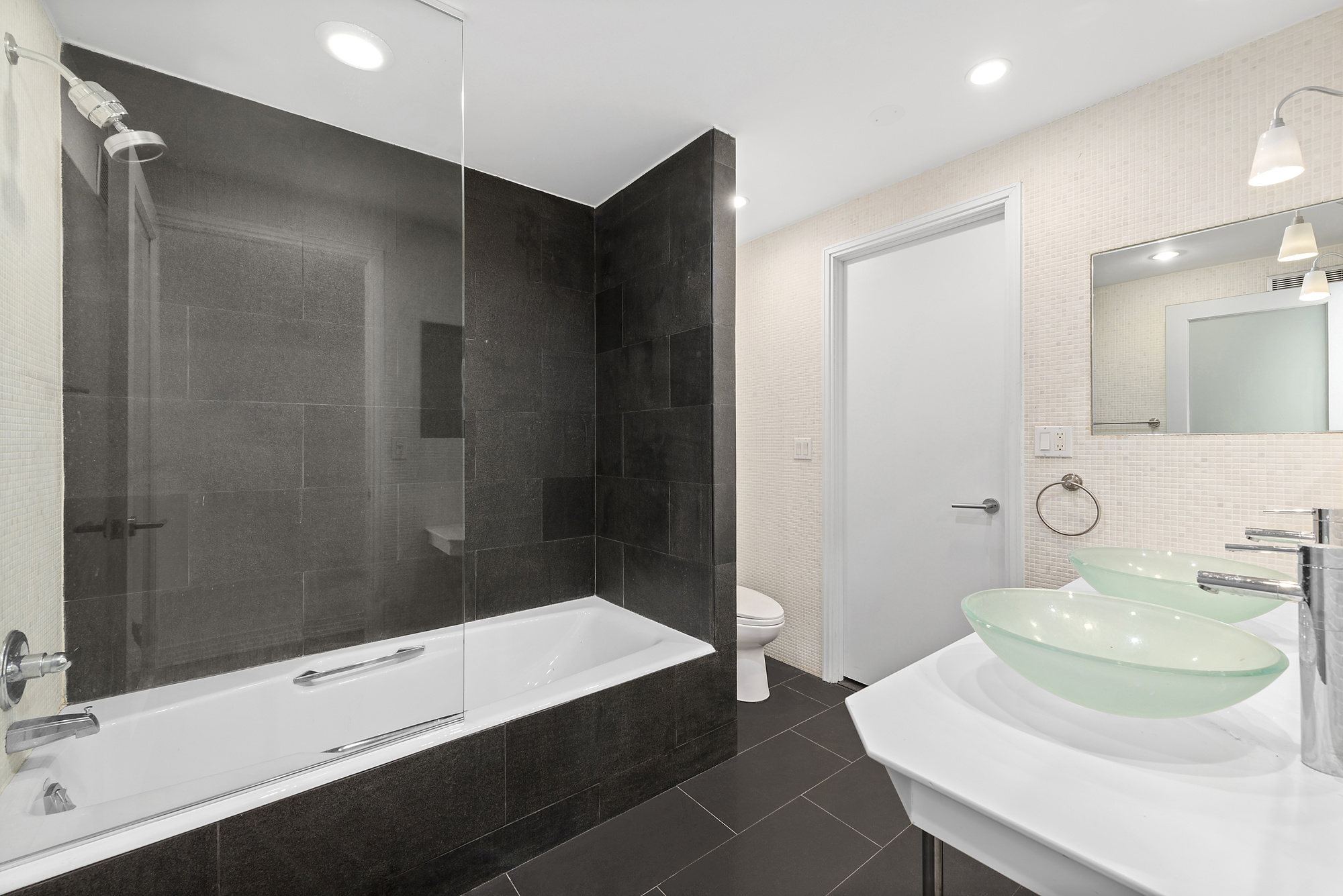 53 Murray Street, Unit 1 Manhattan, NY 10007 - Photo 8 of 12 a bathroom with a sink and a mirror