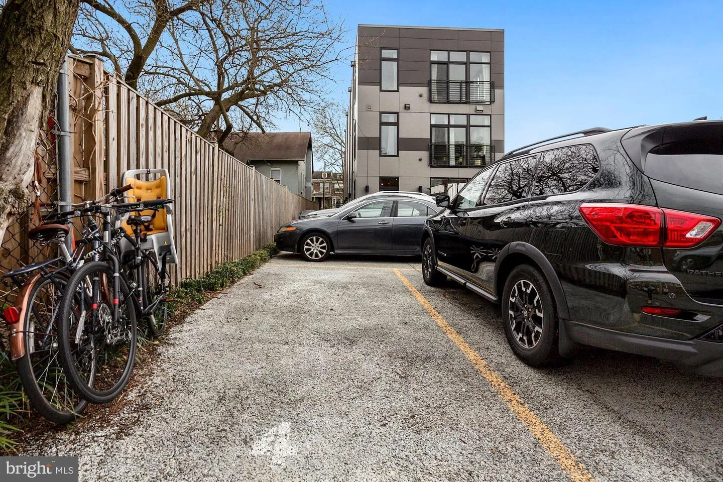 a front view of a residential apartment building with a yard