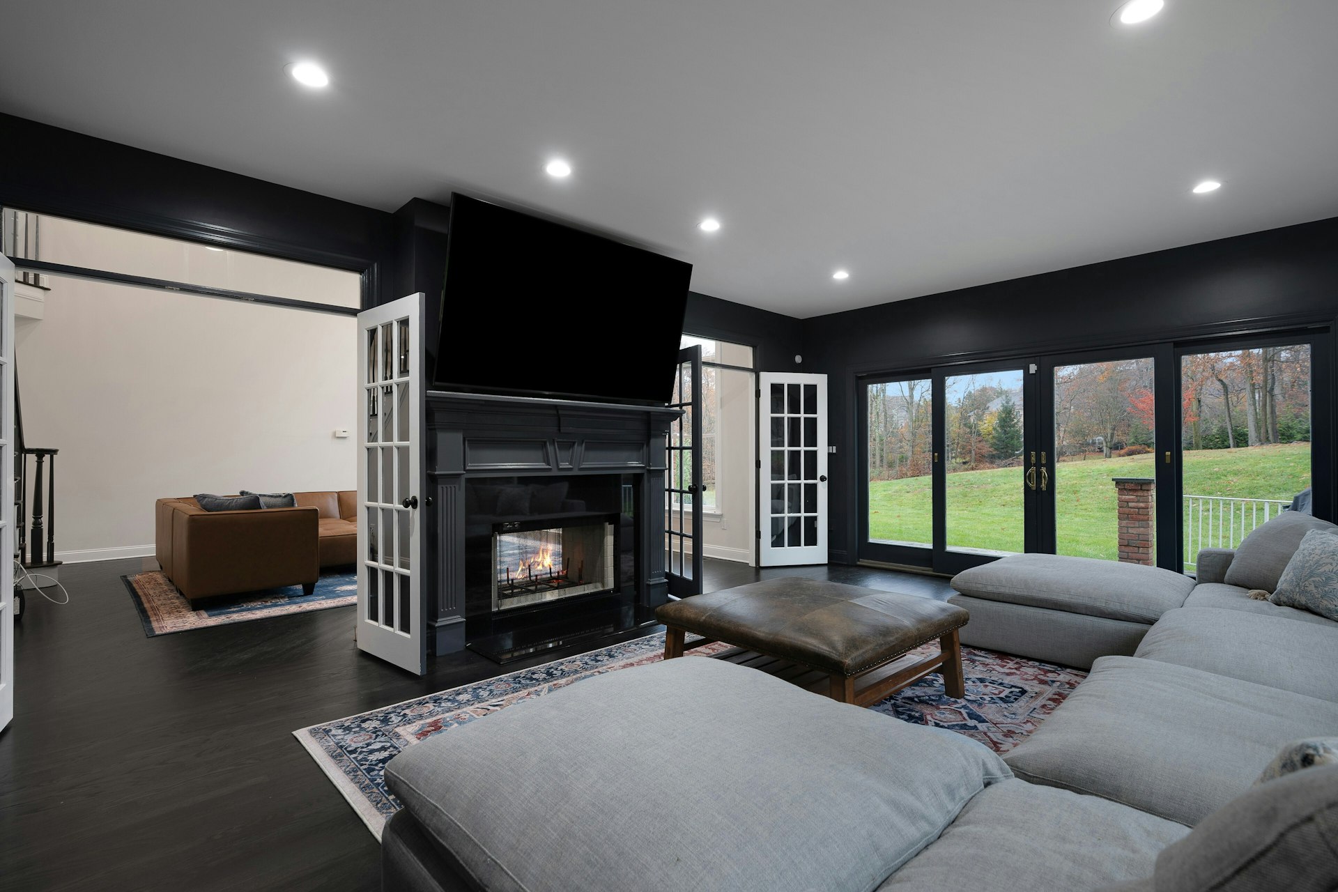 3 Kensington Court Warren, NJ 07059 - Photo 32 of 66 a living room with furniture flat screen tv and a fireplace