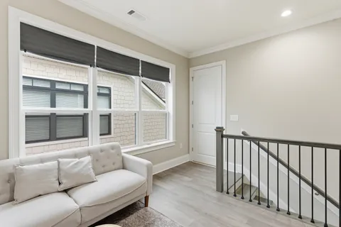 a view of a livingroom with workspace and a window