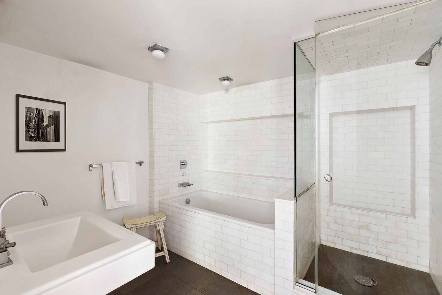 a bathroom with a bathtub and a shower