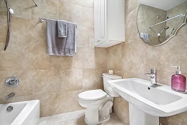 320 7th Avenue, Unit 1 Brooklyn, NY 11215 - Photo 7 of 7 a bathroom with a sink toilet and shower