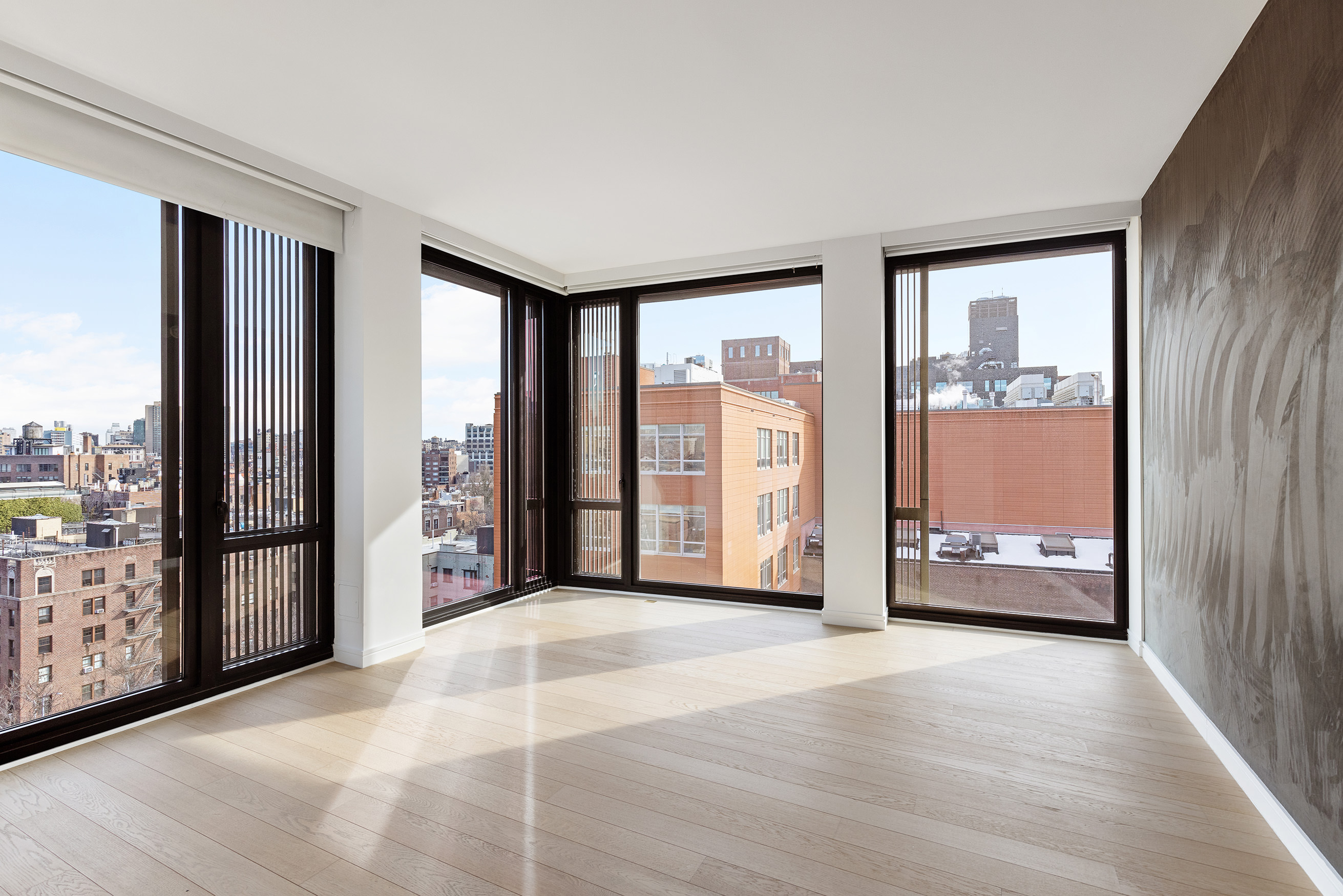 100 Barrow Street, Unit 11A Manhattan, NY 10014 - Photo 8 of 16 a view of an empty room with large windows