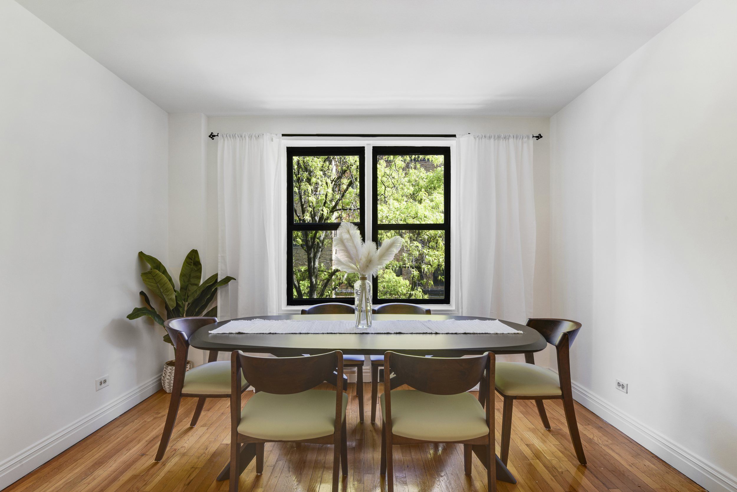 330 East 70th Street, Unit 4F Manhattan, NY 10021 - Photo 2 of 14 a view of a dining room with furniture window and wooden floor