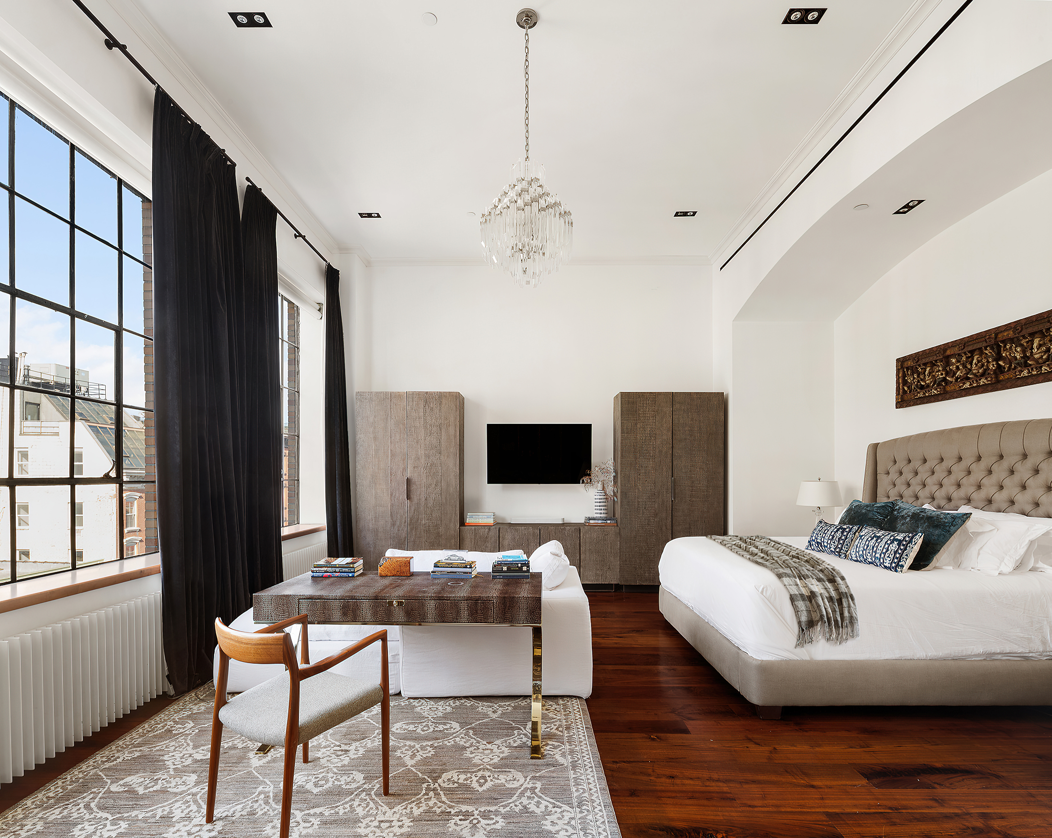 73 Wooster Street, Unit PHA Manhattan, NY 10012 - Photo 12 of 25 a living room with furniture and a flat screen tv