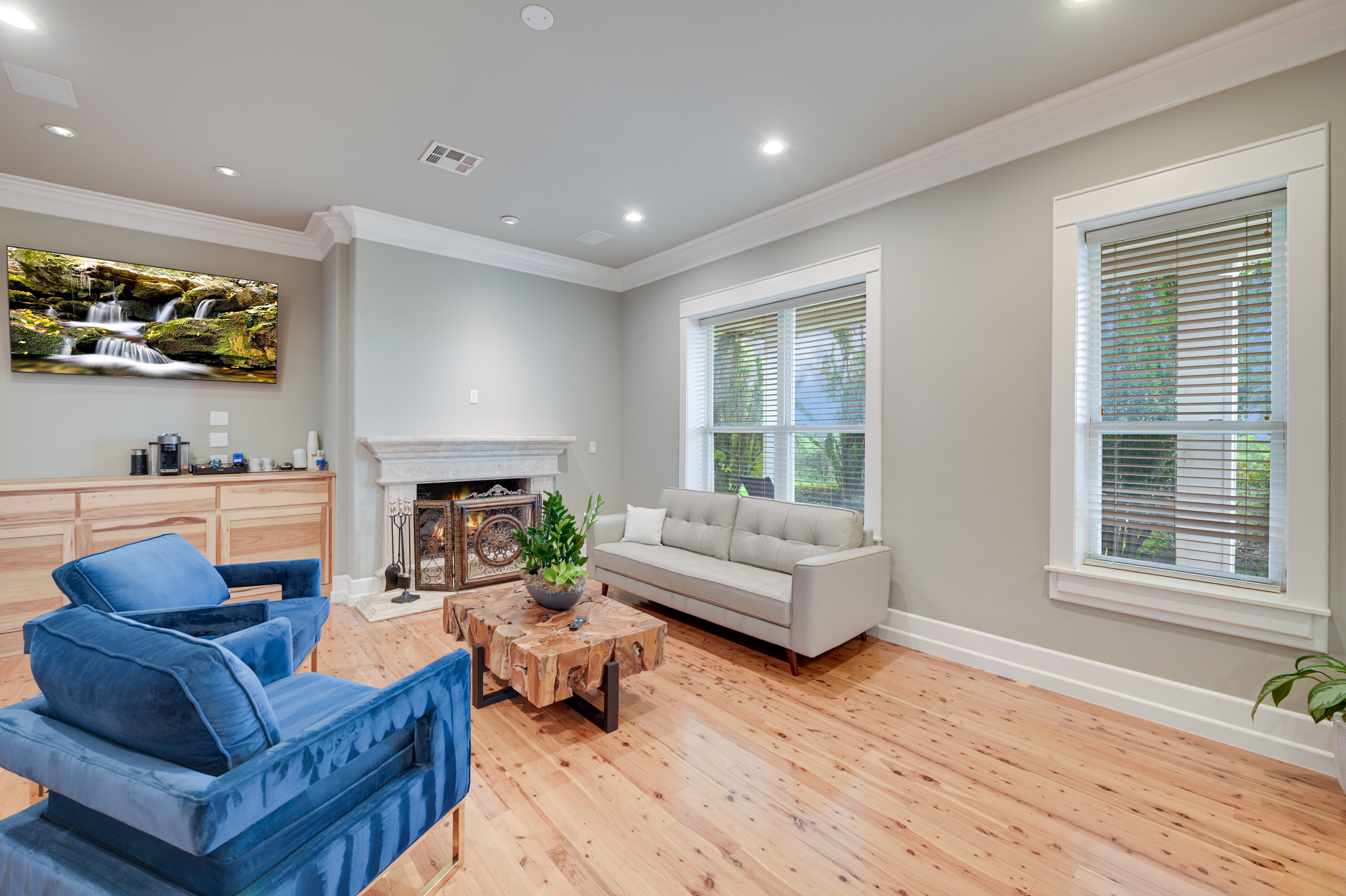 14913 Murfin Road Austin, TX 78734 - Photo 7 of 40 a living room with fireplace furniture and a wooden floor
