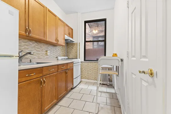 a kitchen with a cabinets and appliances
