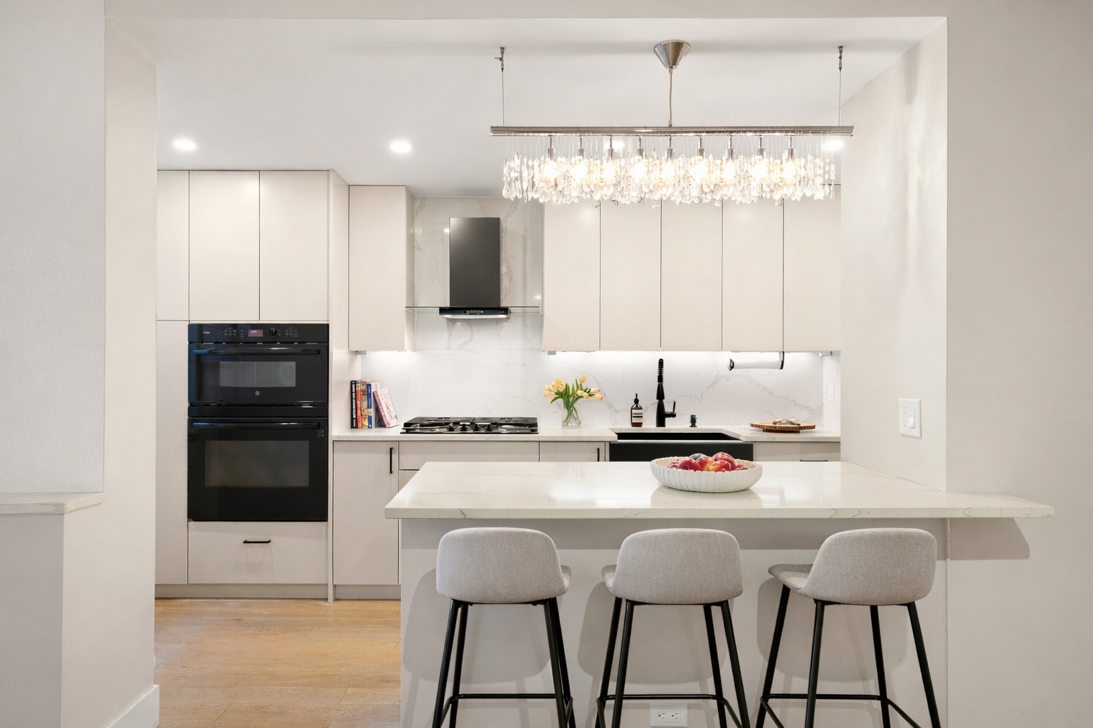 70 East 10th Street, Unit 4V Manhattan, NY 10003 - Photo 6 of 26 a kitchen with granite countertop a stove a sink and a refrigerator