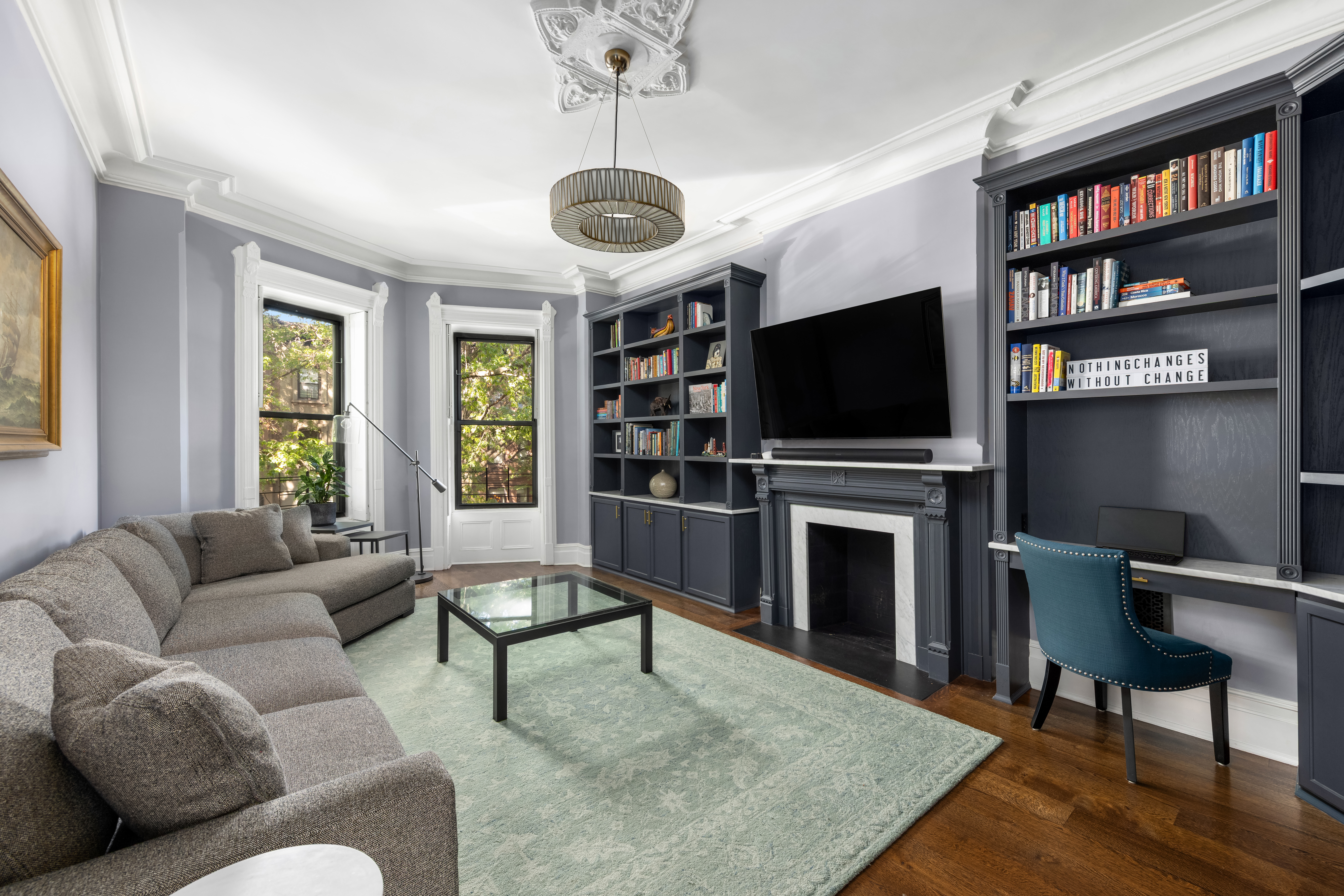 159 6th Avenue, Unit TRIPLEX Brooklyn, NY 11217 - Photo 4 of 19 a living room with fireplace furniture and a flat screen tv