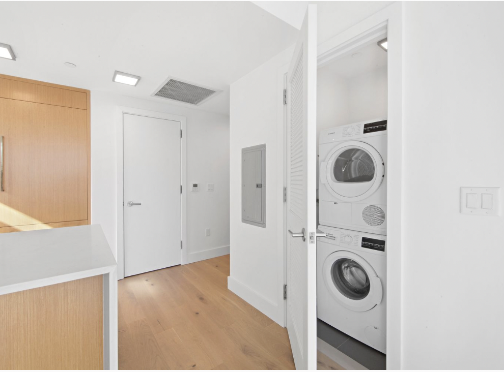 319 Schermerhorn Street, Unit 4B Brooklyn, NY 11217 - Photo 6 of 18 a view of a hallway with washer and dryer