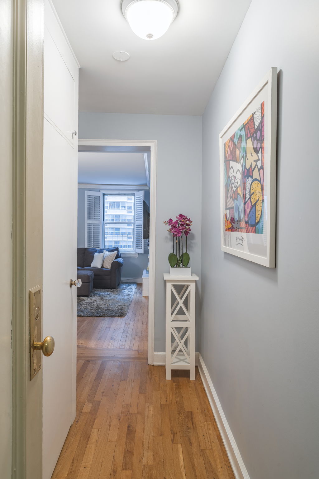155 East 49th Street, Unit 10E Manhattan, NY 10017 - Photo 11 of 12 a view of livingroom with furniture and wooden floor