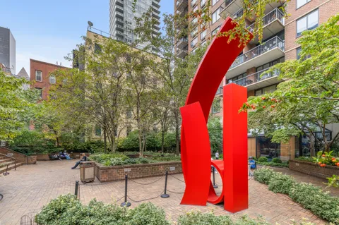 a bench and bench sitting in the middle of a park