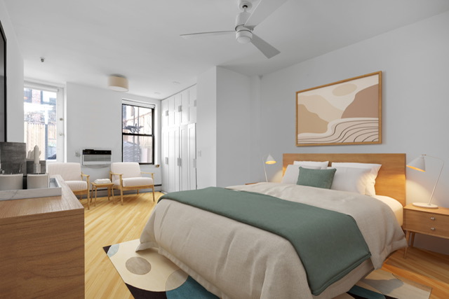 161 Remsen Street, Unit 2C Brooklyn, NY 11242 - Photo 5 of 13 a bed room with a bed and couch
