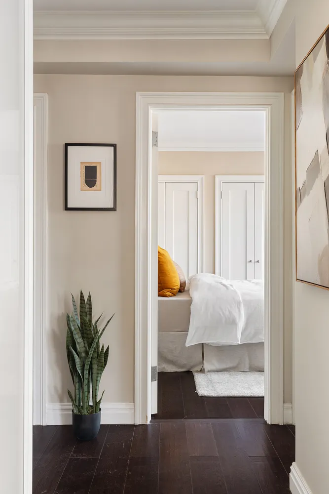 a living room with furniture and a potted plant