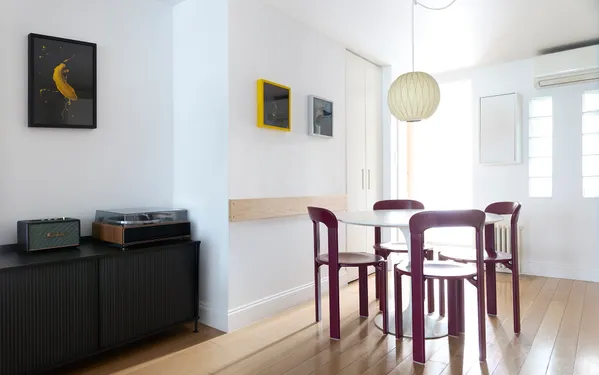 a view of a dining room with furniture and wooden floor