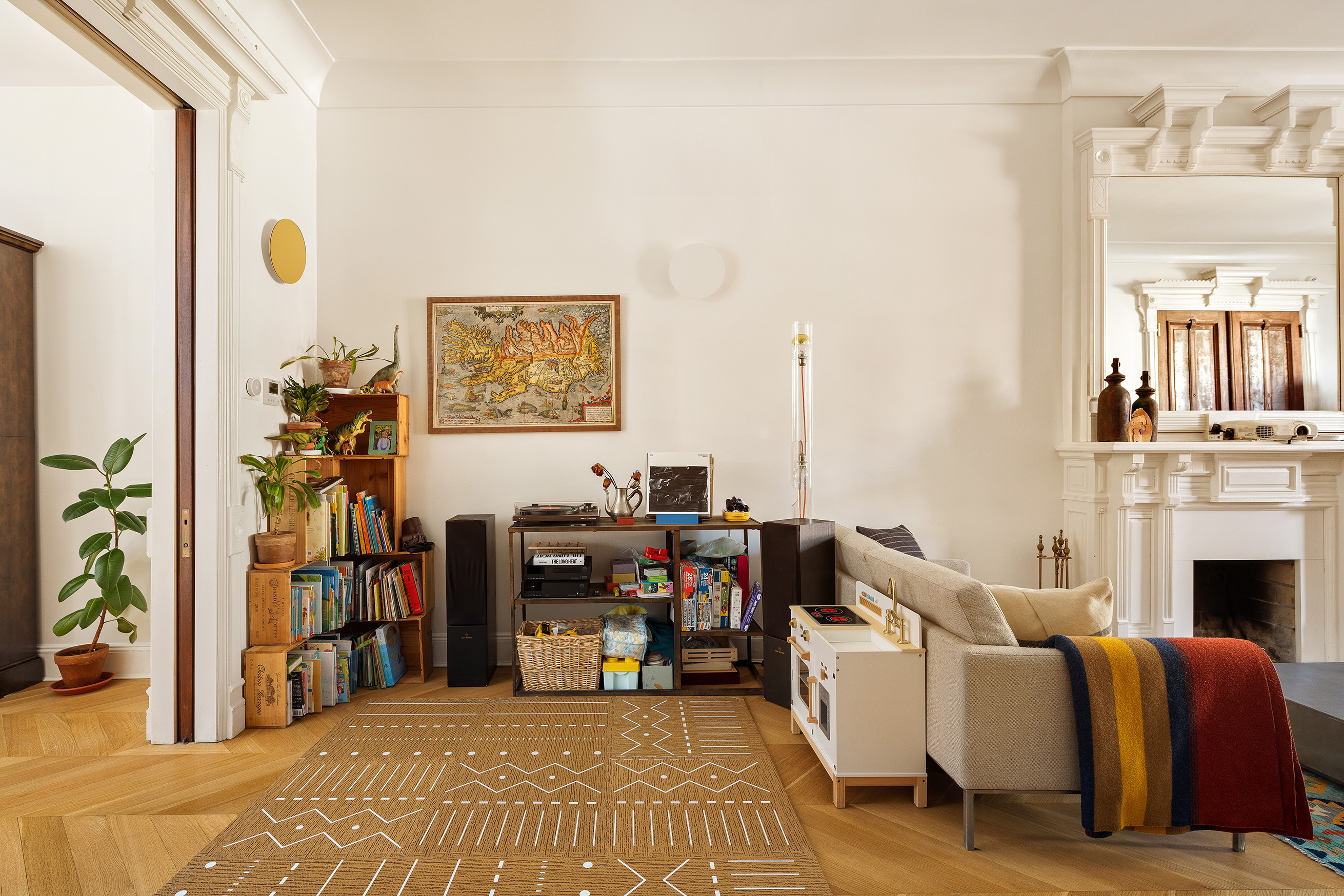 240 St Johns Place, Unit 1 Brooklyn, NY 11217 - Photo 5 of 13 a living room with furniture a fireplace and a flat screen tv