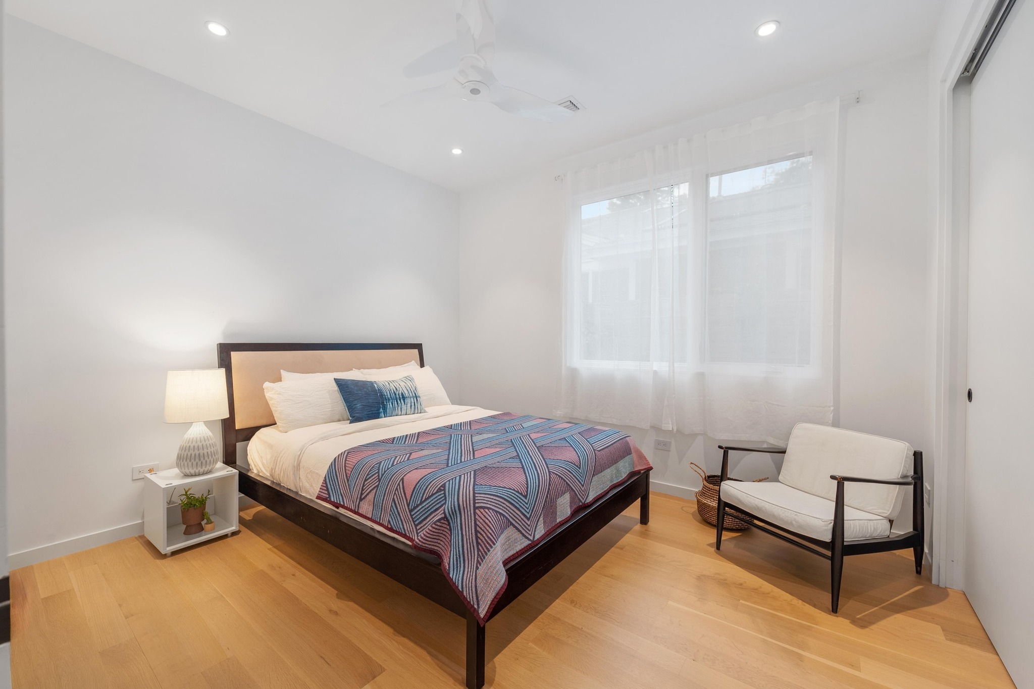 1206 Bickler Road Austin, TX 78704 - Photo 45 of 65 a bedroom with a bed and a couch