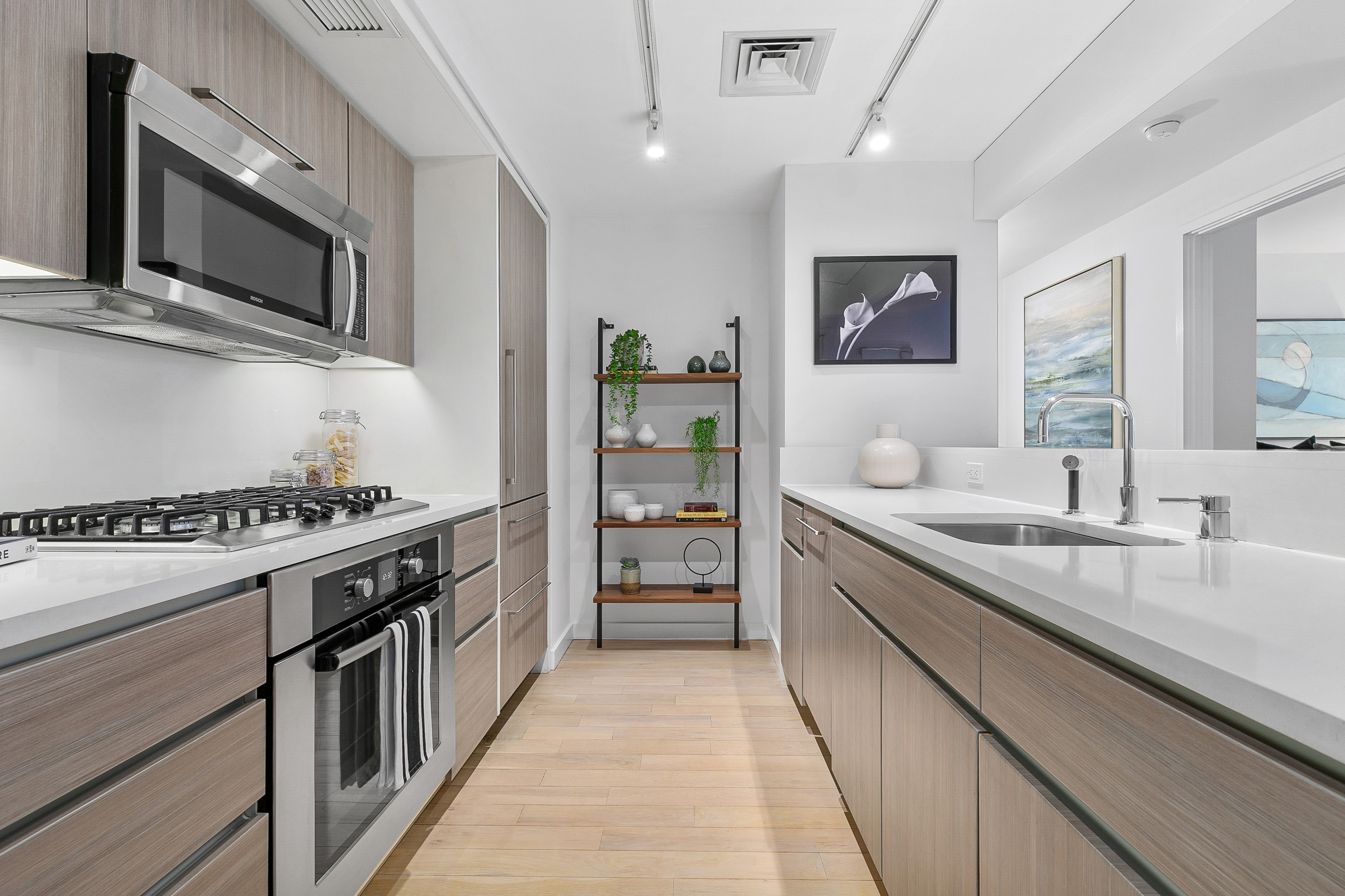 50 Franklin Street, Unit 9A Manhattan, NY 10013 - Photo 3 of 7 a kitchen with stainless steel appliances a sink dishwasher stove top oven and refrigerator