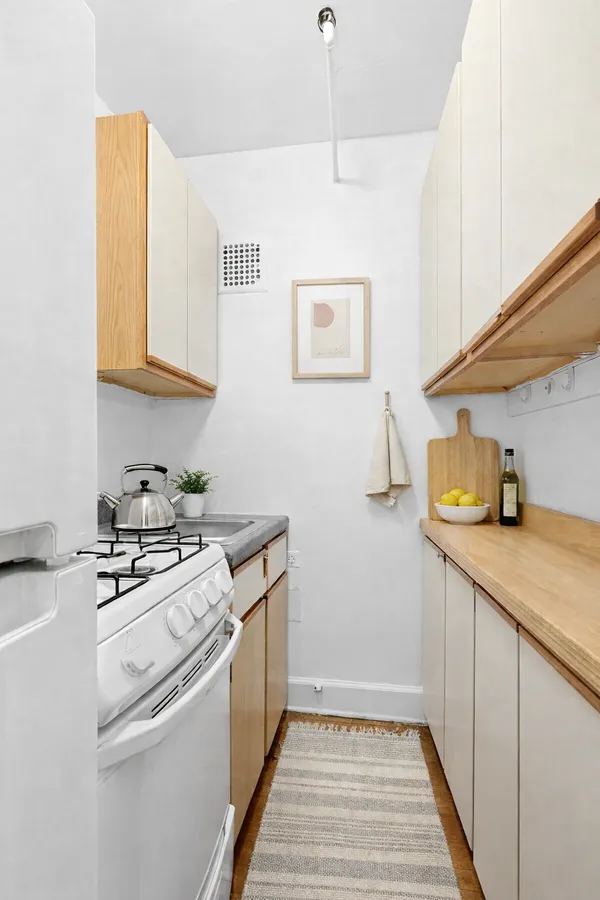 a kitchen with a stove and a sink
