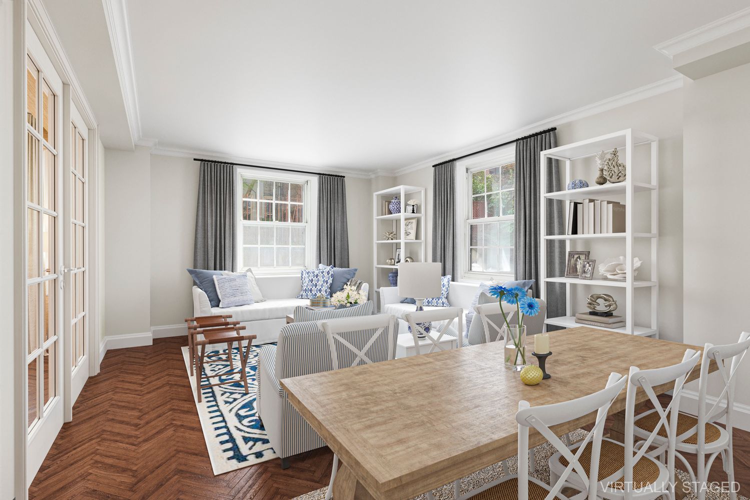 a dining room with furniture a rug and wooden floor