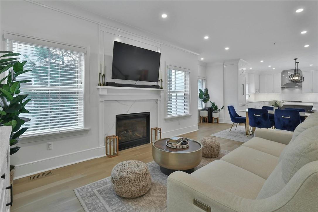 211 Purchase Street, Unit A Rye, NY 10580 - Photo 6 of 22 a living room with furniture a flat screen tv and a fireplace