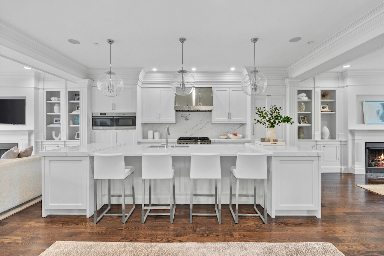 361 Beacon Street, Unit PH Boston, MA 02116 - Photo 3 of 9 a large white kitchen with lots of counter space and stainless steel appliances