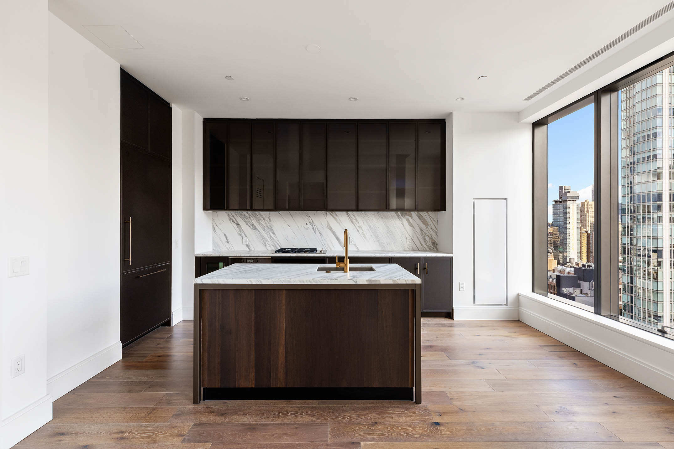 30 East 29th Street, Unit 31B Manhattan, NY 10016 - Photo 3 of 9 a kitchen with stainless steel appliances granite countertop a stove a sink and a refrigerator