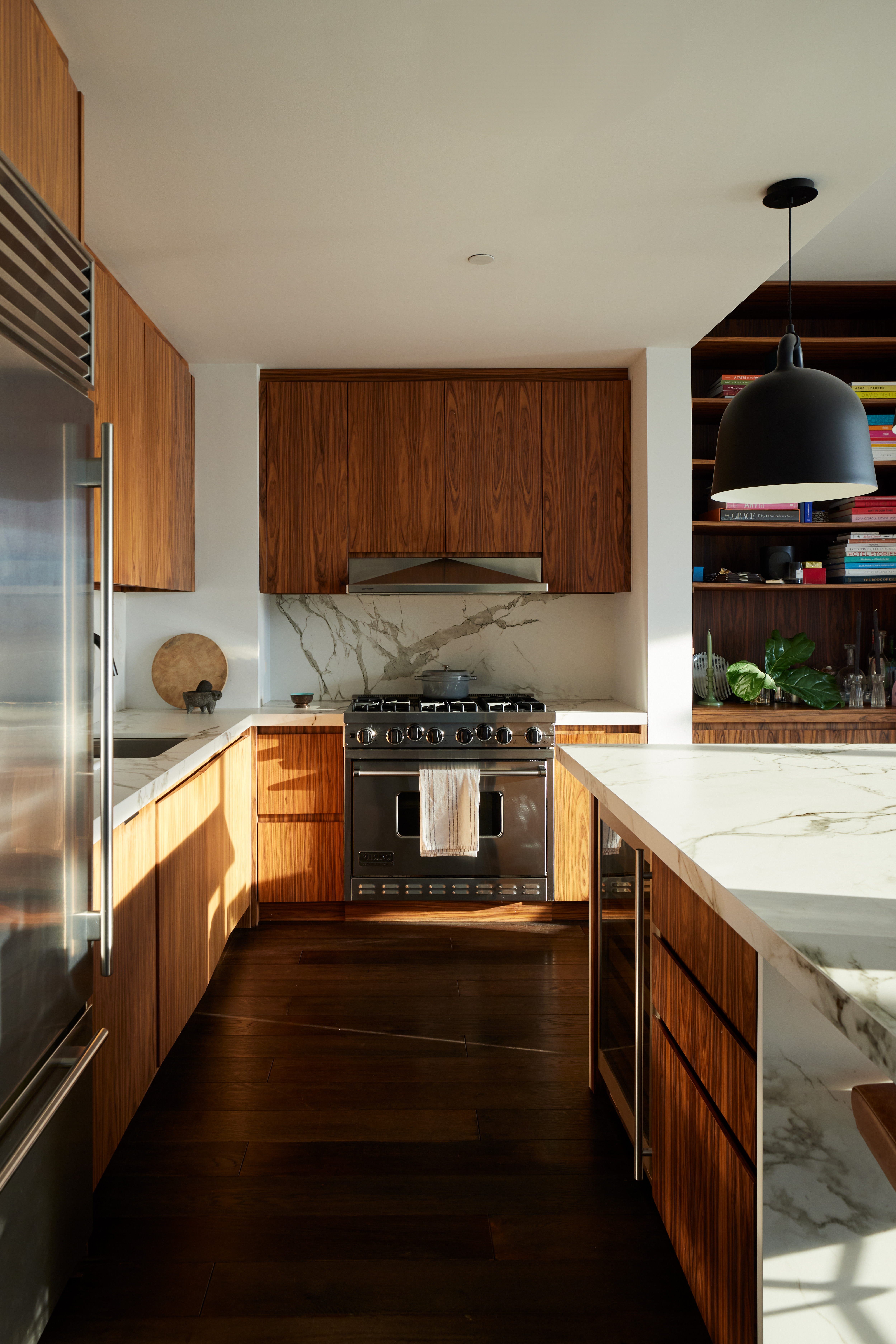 505 Greenwich Street, Unit 14A Manhattan, NY 10013 - Photo 7 of 20 a kitchen with stainless steel appliances a stove a sink and a microwave