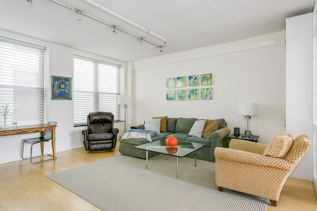 453 Washington Street, Unit 5D Boston, MA 02111 - Photo 4 of 17 a living room with furniture rug and a window