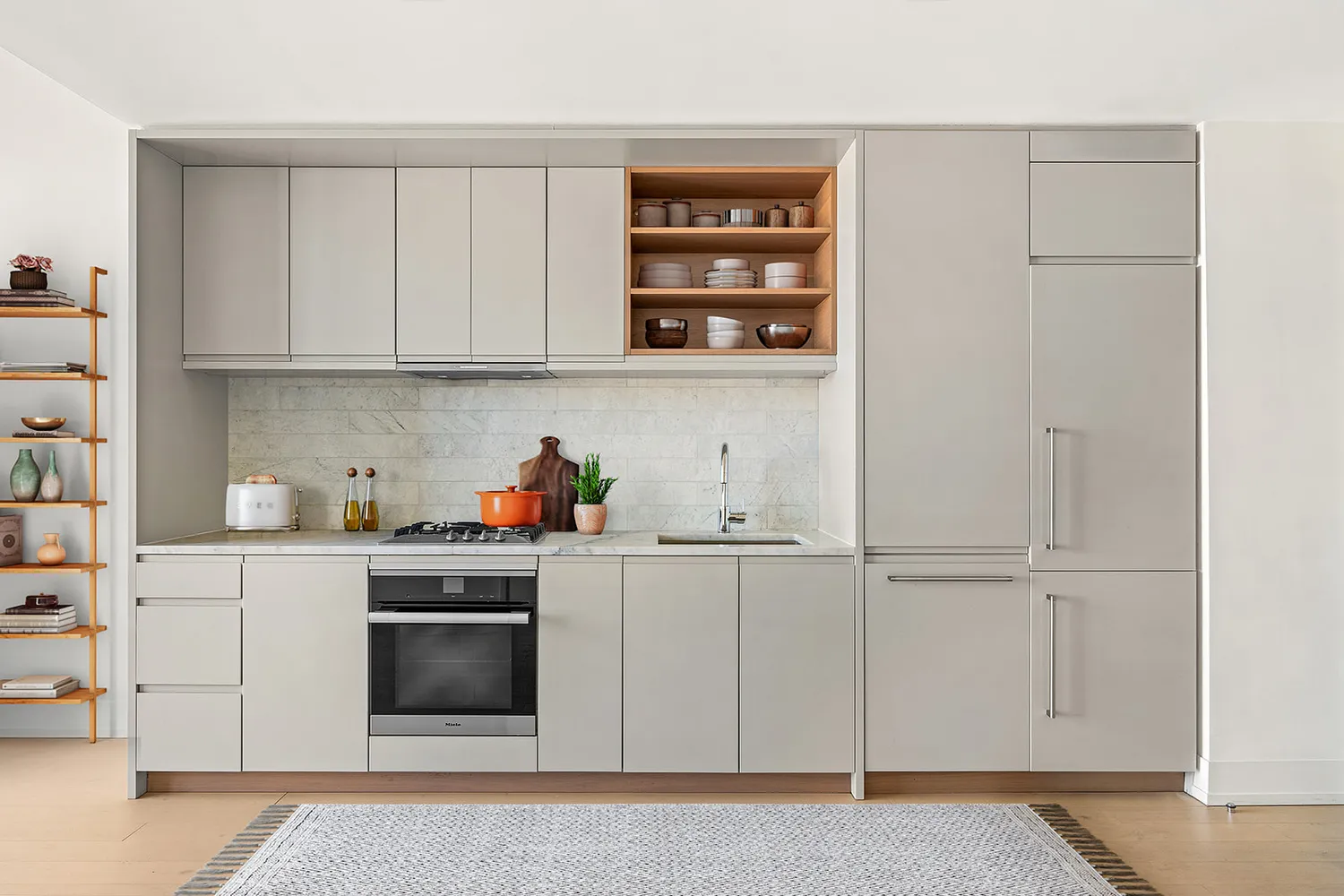 a kitchen with cabinets and white appliances