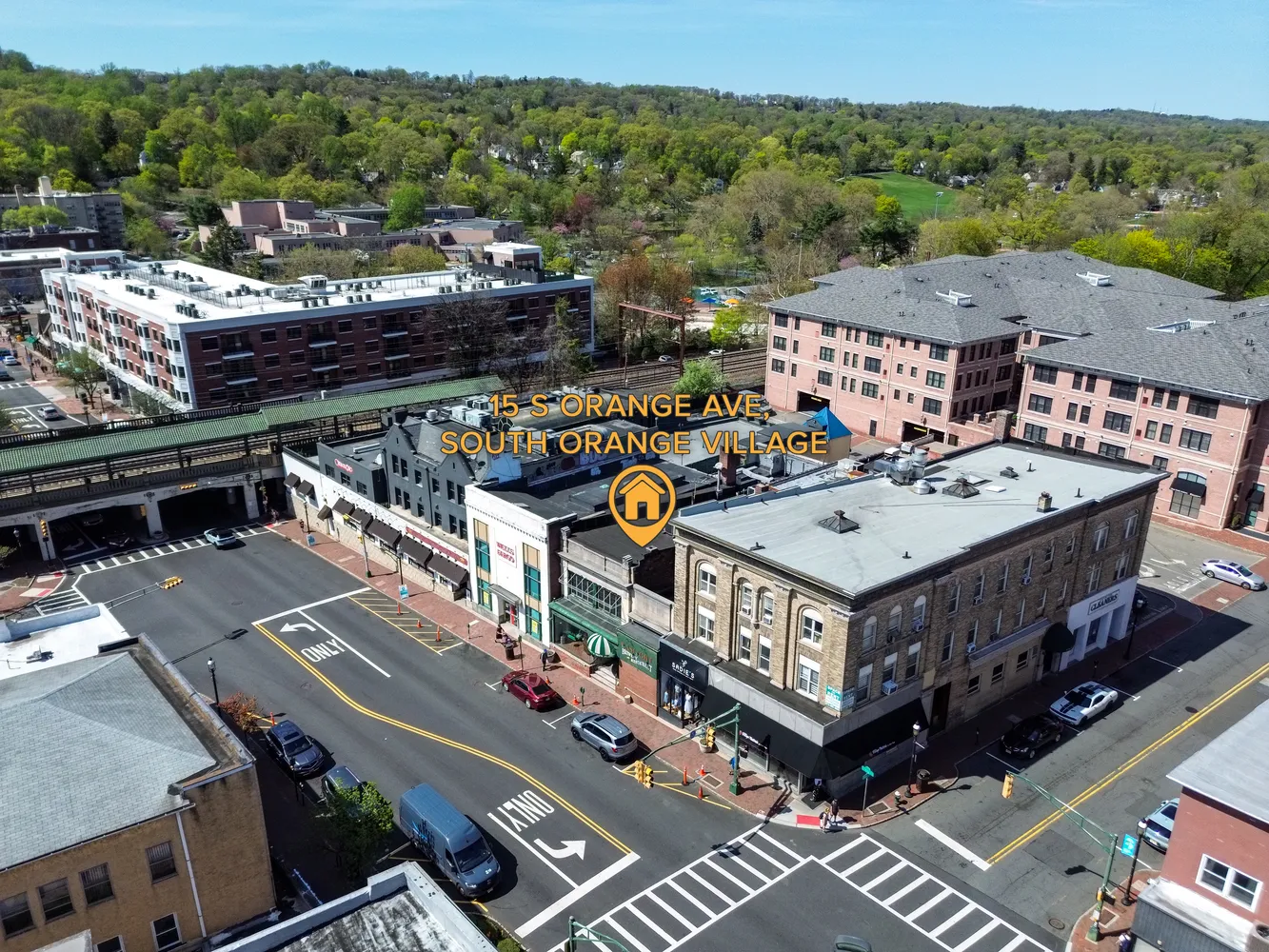 a view of a brick house with large windows